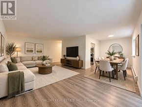 London South (South G) condo for rent - A modern living room with a couch, coffee table, and television.