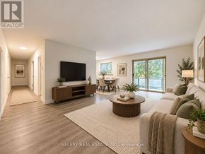 London South (South G) condo for rent - A living room with a flat screen TV, a sofa, and a coffee table.