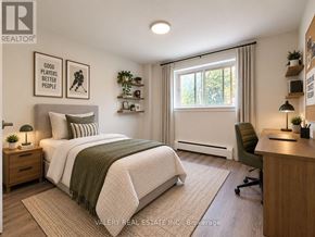 London South (South G) condo for rent - A bedroom with a bed, desk, and chair.