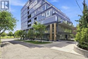 Toronto (Casa Loma) condo for rent - A modern multi-story building with a parking lot in front.