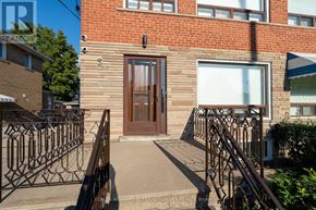 Toronto (Brookhaven-Amesbury) apartment for rent - A brick building with a brown door and a white window.