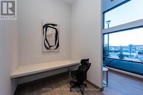 Milton (Co Coates) condo for rent - A room with a desk, chair, and a picture on the wall.
