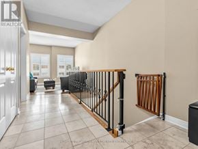 Vaughan (Kleinburg) apartment for rent - A hallway with a black railing and a white door.