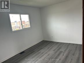 Brampton (Vales Of Castlemore) apartment for rent - A room with a window and wooden flooring.