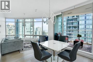 Vancouver apartment for rent - A modern dining room with a large table and chairs.