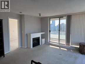 Burnaby apartment for rent - A living room with a fireplace and sliding glass doors.