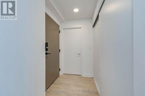 Mississauga (City Centre) condo for rent - A hallway with a brown door and a white door.