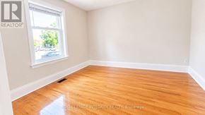 Ottawa townhouse for rent - A room with wooden flooring and a window letting in natural light.