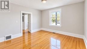 Ottawa townhouse for rent - A room with a door and a window with a view of trees.