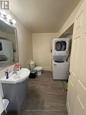 Ottawa townhouse for rent - A bathroom with a sink, toilet, and a washing machine.