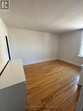 Ottawa townhouse for rent - A room with wooden flooring and white walls.