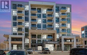 Milton (Cb Cobban) condo for rent - A modern multi-story building with the text "REALTOR" on the top left corner.