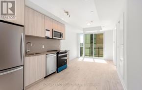 Milton (Cb Cobban) condo for rent - A kitchen with a refrigerator, microwave, and dishwasher.