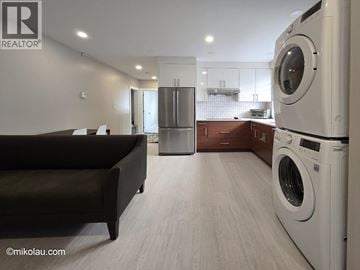 Burnaby apartment for rent - A modern laundry room with a washer and dryer.