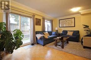 Markham (Old Markham Village) townhouse for rent - A living room with a couch, chair, and coffee table.