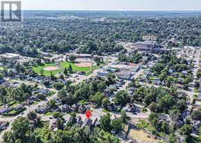 Orillia triplex for rent - An aerial view of a residential area with a hospital in the background.