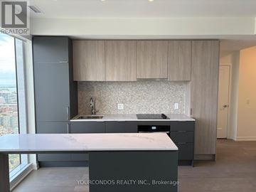 Toronto (Church-Yonge Corridor) condo for rent - A kitchen with a sink and a counter top.