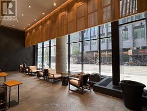 Toronto (Church-Yonge Corridor) condo for rent - A waiting area with chairs and tables is shown.