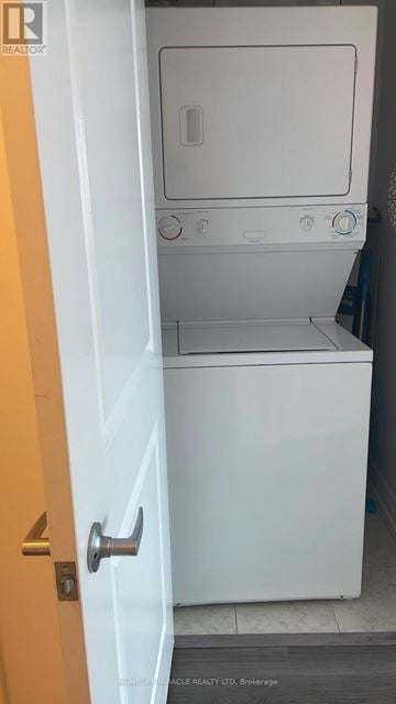 Toronto (Bayview Village) condo for rent - A white dishwasher is in a small kitchen.