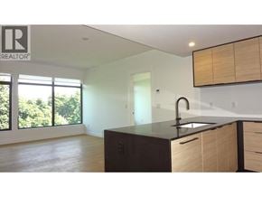 Vancouver apartment for rent - A kitchen with a sink and cabinets.