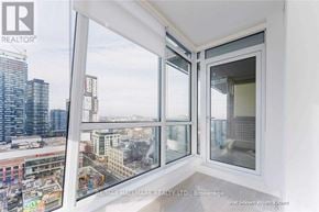 Toronto (Waterfront Communities) condo for rent - A real estate company's brochure shows a unit with a view of a cityscape.