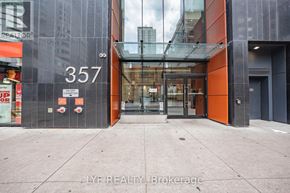 Toronto (Waterfront Communities) condo for rent - The entrance to a building with the number 357 on it.