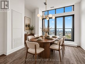 Toronto (Mount Pleasant West) condo for rent - A dining room with a table set for two and a view of the city.