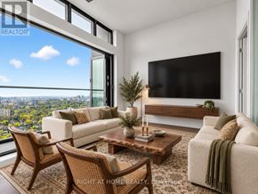Toronto (Mount Pleasant West) condo for rent - A modern living room with a view of the city.