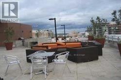 Toronto (Moss Park) condo for rent - A patio with a table and chairs is shown.