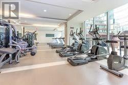 Toronto (Moss Park) condo for rent - A gym with treadmills, elliptical machines, and other exercise equipment.