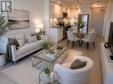Toronto (Humber Heights) condo for rent - A modern living room with a glass coffee table and a white sofa.