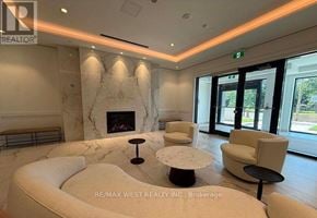 Toronto (Humber Heights) condo for rent - A living room with a fireplace and a white sofa.