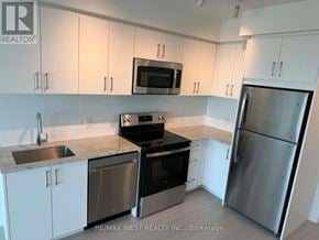 Toronto (Humber Heights) condo for rent - A kitchen with white cabinets and stainless steel appliances.