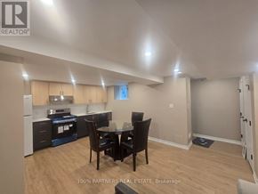 Toronto (Bayview Village) apartment for rent - A kitchen with a dining table and chairs in a room.