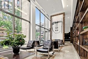 Toronto (Bay Street Corridor) condo for rent - A modern waiting area with a large window and a potted plant.