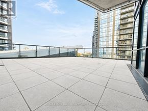 Mississauga (Hurontario) condo for rent - A rooftop terrace with a tiled floor and a glass railing.