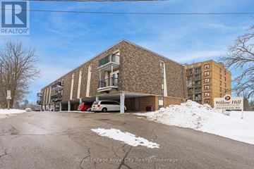 Guelph (Junction/Onward Willow) condo for rent - A building with the sign "Willow Hill" on it.