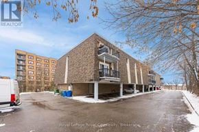 Guelph (Junction/Onward Willow) condo for rent - A white van is parked on the left side of a street.