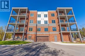 Clearview (Creemore) condo for rent - A modern multi-story apartment building with a clear blue sky in the background.