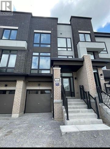 Oshawa (Samac) townhouse for rent - A modern two-story residential building with a garage.