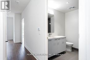 Toronto (Edenbridge-Humber Valley) condo for rent - A bathroom with a toilet, sink, and mirror.