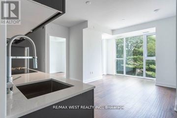 Toronto (Edenbridge-Humber Valley) condo for rent - A modern kitchen with a sink and a stainless steel faucet.