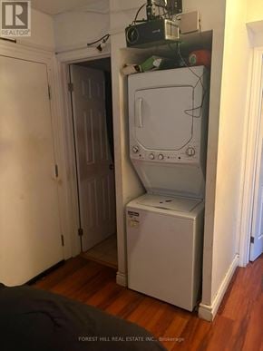 Toronto (Beechborough-Greenbrook) apartment for rent - A white refrigerator is in a narrow hallway.