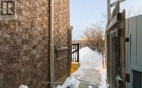 Brampton (Fletcher's Meadow) apartment for rent - A snow-covered pathway leads to a wooden gate.