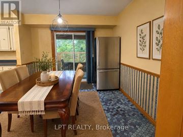 London North (North K) apartment for rent - A dining room with a wooden table and chairs.