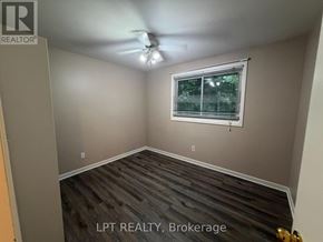 London North (North K) apartment for rent - A room with a window and a ceiling fan.