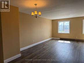 Prescott apartment for rent - A room with a chandelier and a window.