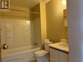 Prescott apartment for rent - A bathroom with a tub, toilet, and sink.