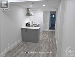 Ottawa multi-family for rent - A modern kitchen with a sink and cabinets.