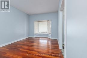 Whitby (Blue Grass Meadows) apartment for rent - A room with wooden flooring and a window with blinds.